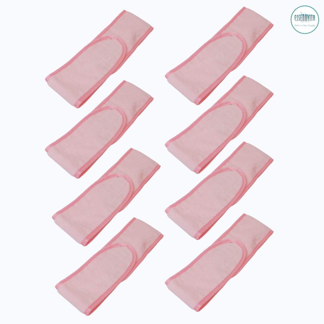 Set of 8 pink microfiber spa headbands stacked, closed on white background