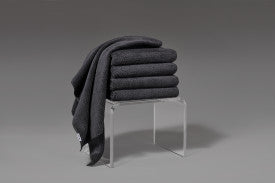 dark grey fromm softees plush microfiber towels folded on acrylic stand 6 pack 20x30 salon spa