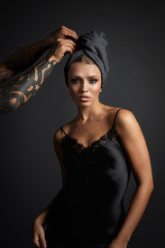 female model with grey microfiber towel wrapped around wet hair turban fromm softees plush salon use