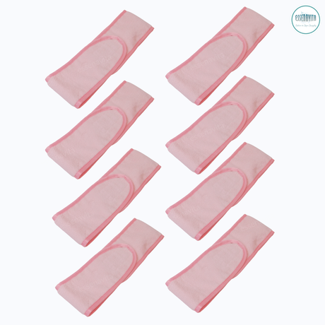 Set of 8 pink microfiber spa headbands stacked, closed on white background