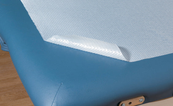 close up of graham waterproof poly coated bed paper on massage table