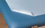 close up of graham waterproof poly coated bed paper on massage table