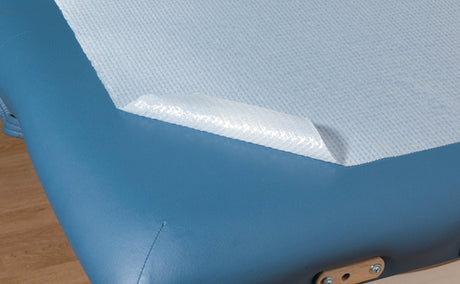 close up of graham waterproof poly coated bed paper on massage table