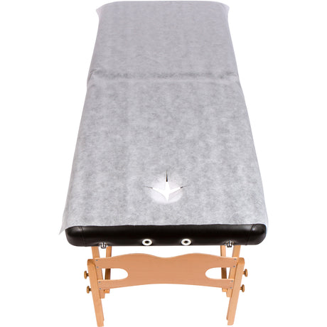 non woven bed cover sheet on massage table with face hole open 32 inch wide disposable spa cover